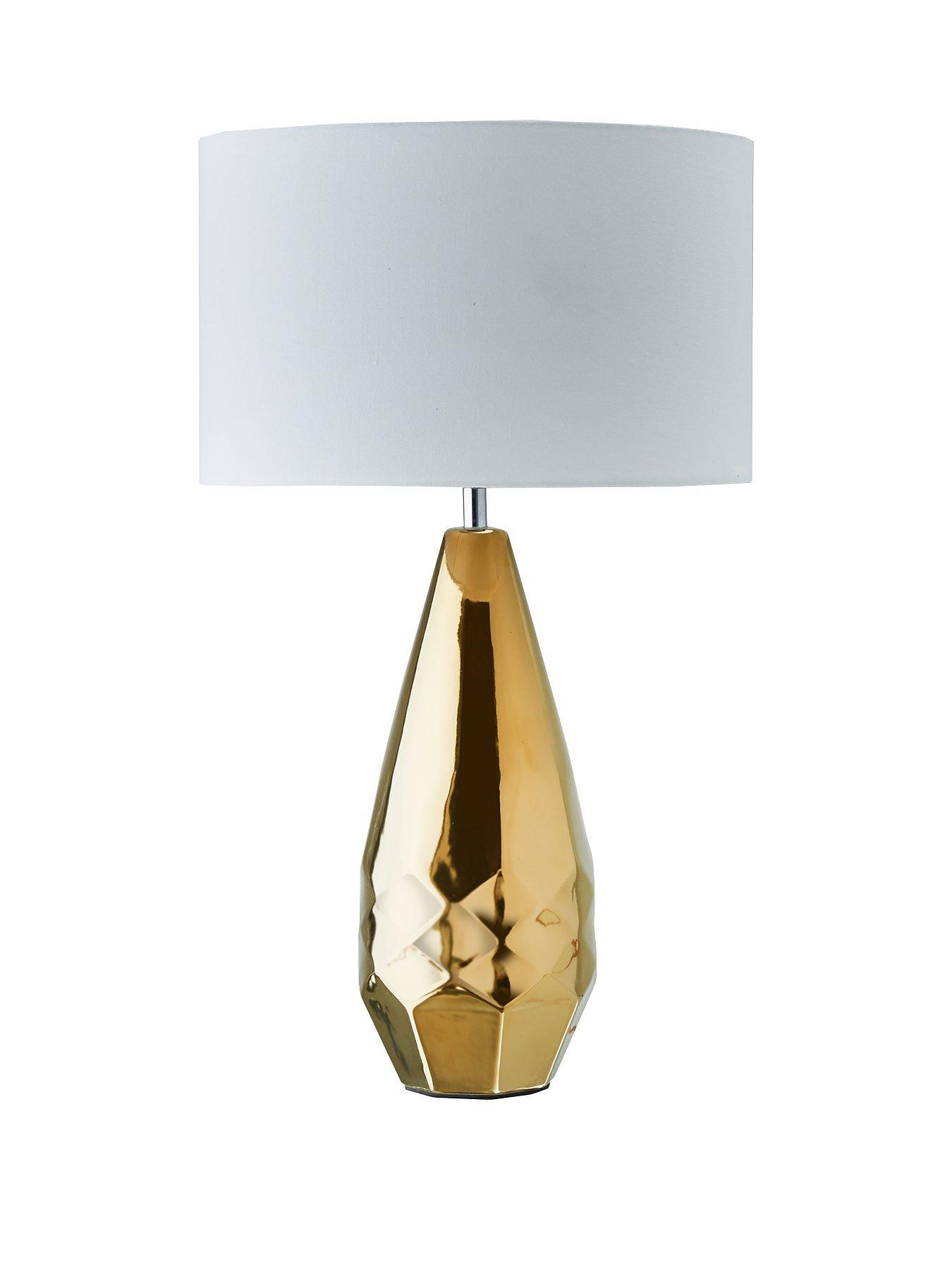 Gold and white geo lamp - home accessories inspiration| Today we're talking inspiration for adding green to your living room. Green is a really versatile colour to decorate your home with. But, which colours and tones work well? What kind of accessories work with green? This post gives you ideas for pulling together an elegant green colour palette and pieces for your home. Read more: kittyandb.com #homeaccessories #lamp #goldandwhite #interiordecoratinginspiration