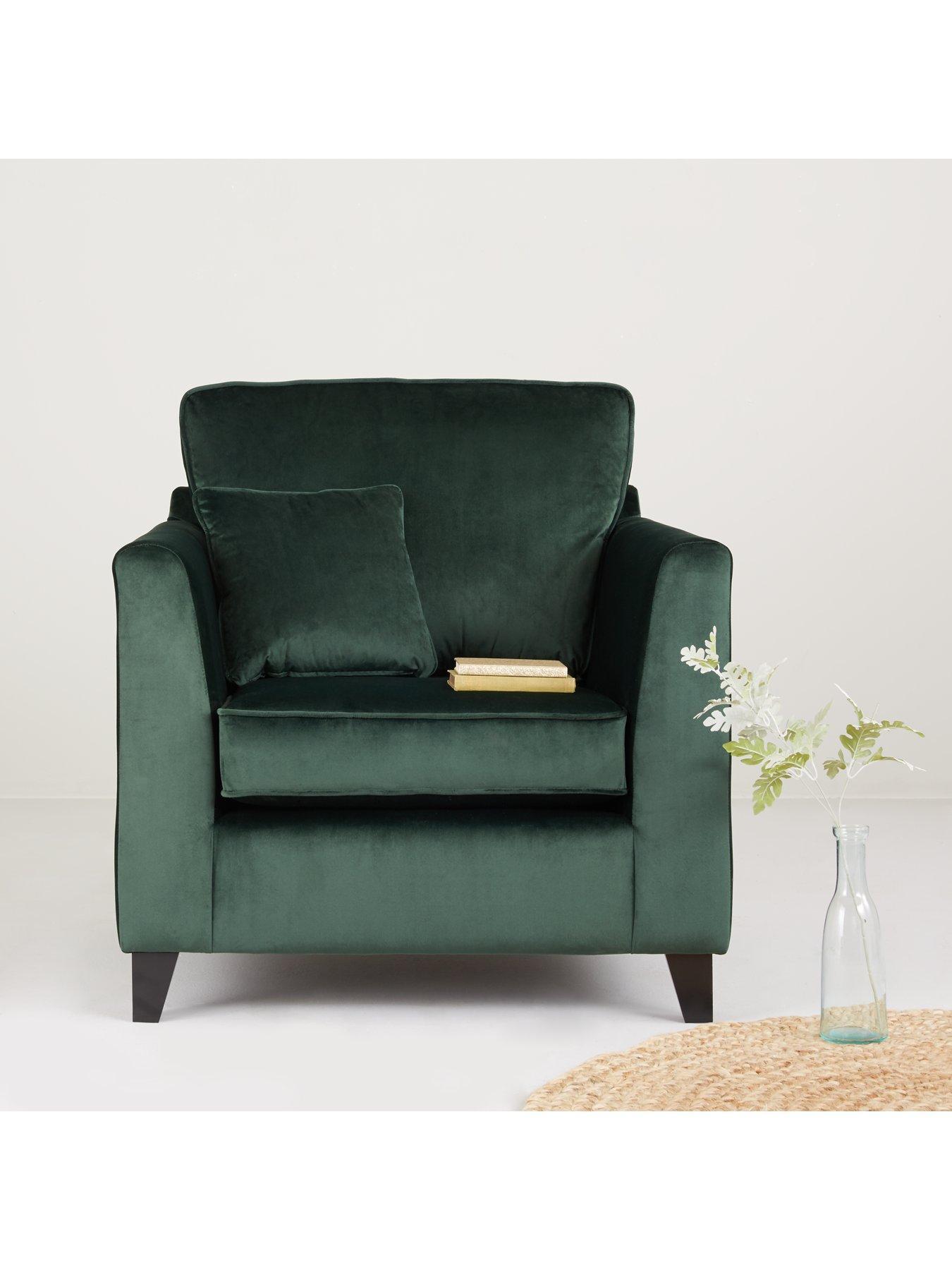 Green velvet armchair - home accessories inspiration| Today we're talking inspiration for adding green to your living room. Green is a really versatile colour to decorate your home with. But, which colours and tones work well? What kind of accessories work with green? This post gives you ideas for pulling together an elegant green colour palette and pieces for your home. Read more: kittyandb.com #greenlivingroom #greenaccessories #greencolorpalette #interiordecoratinginspiration #greenaesthetic #greenarmchair