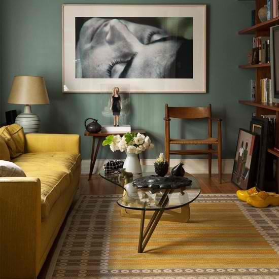 Green and Yellow Living Room| Today we're talking inspiration for adding green to your home. Green is a really versatile colour to decorate your home with. But, which colours and tones work well? What kind of accessories work with green? This post gives you ideas for pulling together an elegant green colour palette and pieces for your home. Read more: kittyandb.com #greenlivingroom #interiordecoratinginspiration #yellowsofa #colourpalette #greenaesthetic #greenwalls #colourfulhomedecor