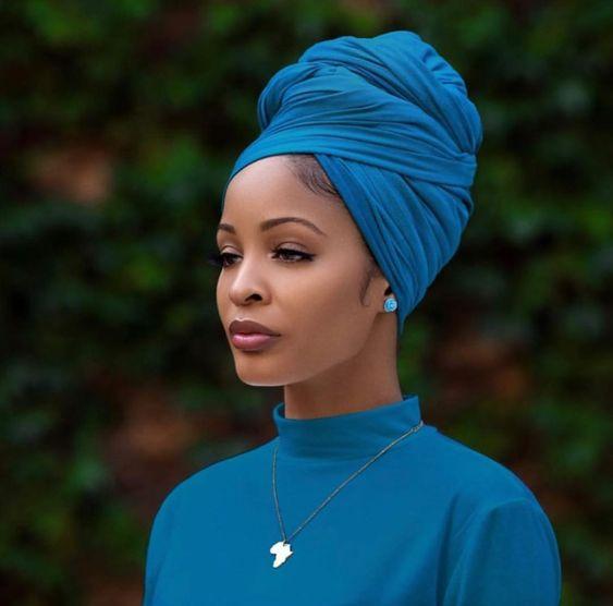Woman wearing blue turban and blue top