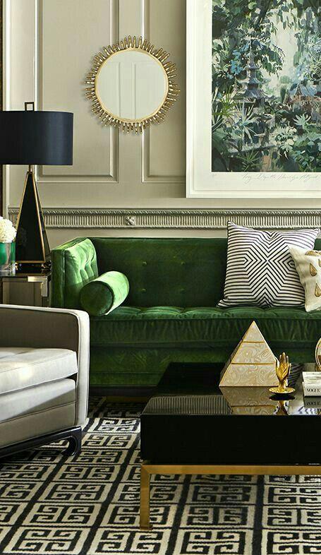 Green Sofa with Gold highlights and black and white geometric print accessories