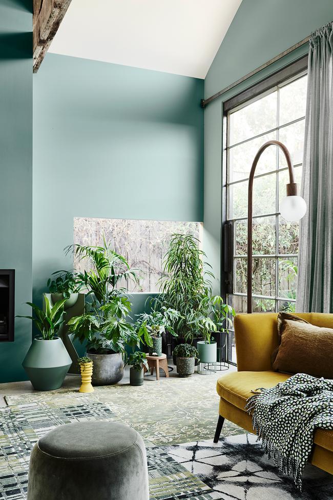 Natural Green and Yellow Living Room Inspiration| Today we're talking inspiration for a green living room. Green is a really versatile colour to decorate your home with. But, which colours and tones work well? What kind of accessories work with green? This post gives you ideas for pulling together an elegant green colour palette and pieces for your home. Read more: kittyandb.com #greenlivingroom #greencolorpalette #roomdecor #greenaesthetic #greenandyellow #plantdecor