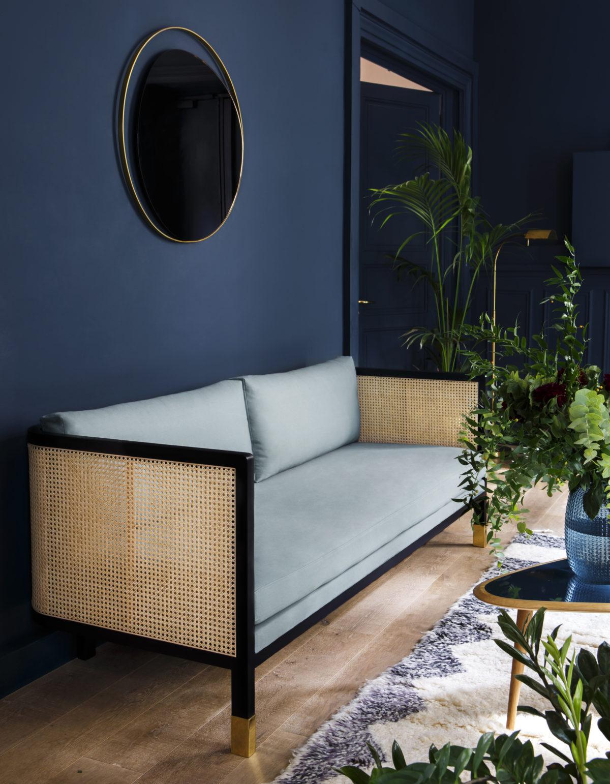 Blue Rattan Sofa Room Decor Inspiration| Blue is a really versatile colour to decorate your home with. But, which colours and tones work well? What kind of accessories work with blue? This post gives you the shades you need to recreate this ombre wall, plus ideas for pulling together an elegant blue colour palette and pieces for your home. Read more: kittyandb.com #blueroom #livingroom #colourfulhomedecor #bluecolorpalette #rattansofa #blueaesthetic #StyleItDark