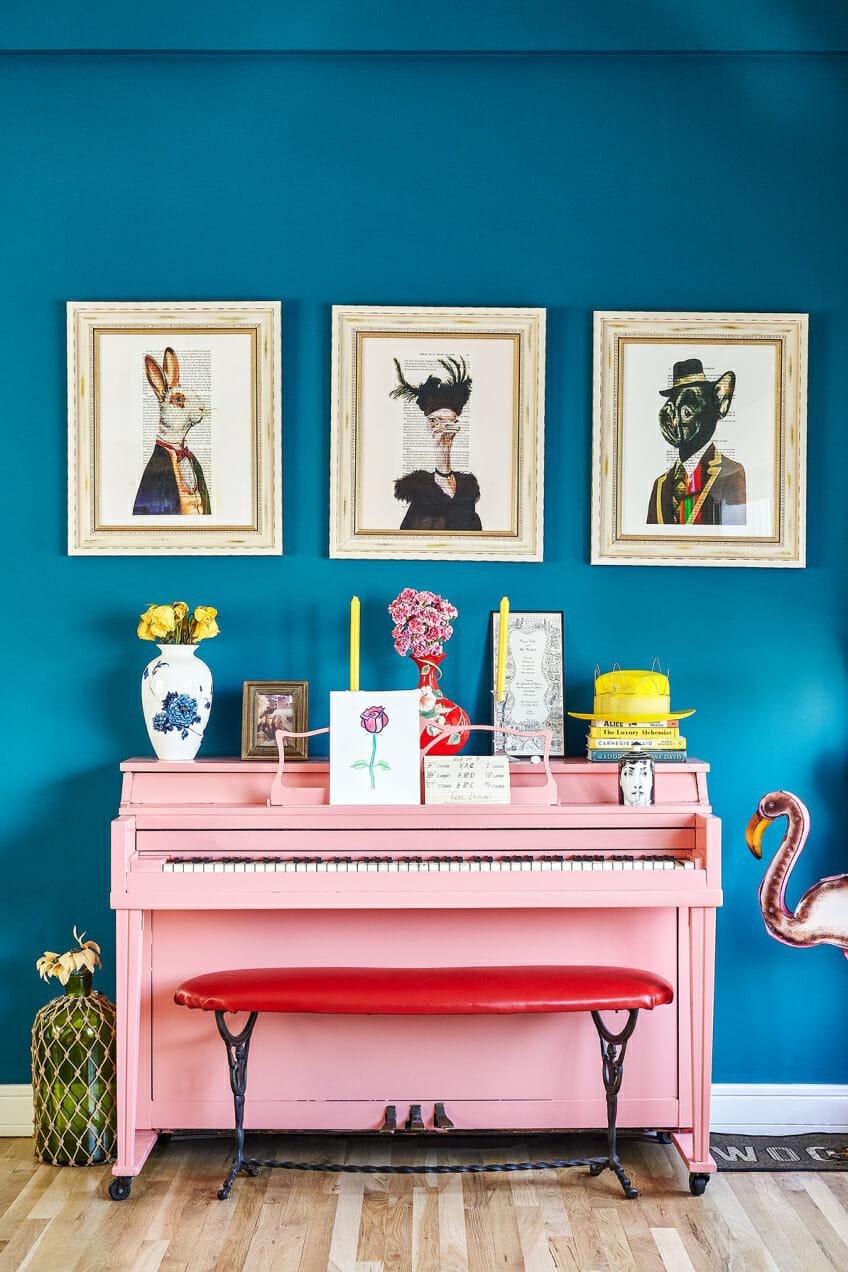Blue Wall and Pink Piano Colourful Room Decor | Blue is a really versatile colour to decorate your home with. But, which colours and tones work well? What kind of accessories work with blue? This post gives you ideas for pulling together an elegant blue colour palette and pieces for your home. Read more: kittyandb.com #bluewall #colourfulhomedecor #colorpalette ##interiordecoratinginspiration #pinkaesthetic
