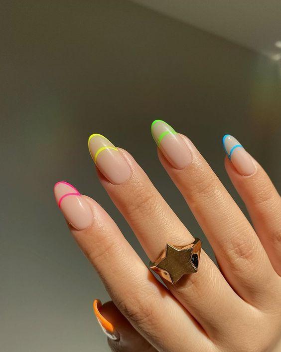 Neon Negative Space French Manicure Tips | We love a classic French manicure, it's elegant and timeless. But, we also love classic with a twist. Here are all the alternative French manicure styles you need | www.kittyandb.com #FrenchManicure #Nails #NailArt #French #Tip #Rainbow #NegativeSpace