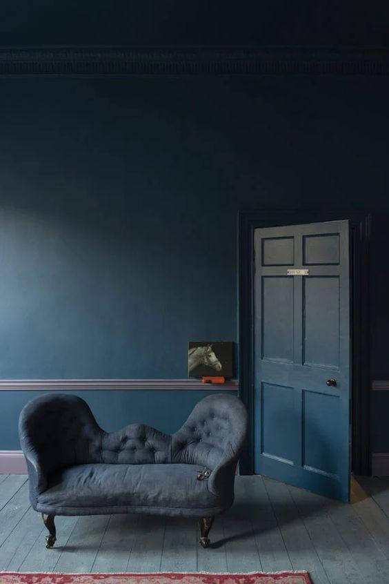 Moody Stiffkey Blue Tonal Living Room| Blue is a really versatile colour to decorate your home with. But, which colours and tones work well? What kind of accessories work with blue? This post gives you the shades you need to recreate this ombre wall, plus ideas for pulling together an elegant blue colour palette and pieces for your home. Read more: kittyandb.com #blueroom #livingroom #colourfulhomedecor #bluecolorpalette #stiffkeyblue #blueaesthetic