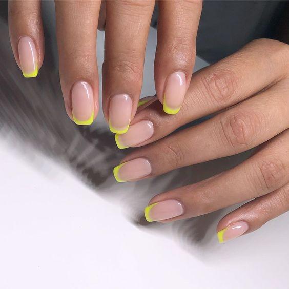 Neon Yellow French Manicure Tips | We love a classic French manicure, it's elegant and timeless. But, we also love classic with a twist. Here are all the alternative French manicure styles you need | www.kittyandb.com #Neon #Nails #NailArt #French #Tip #Yellow