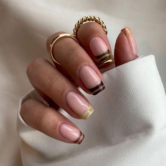Tonal Brown Neutral Stripe French Manicure | We love a classic French manicure, it's elegant and timeless. But, we also love classic with a twist. Here are all the alternative French manicure styles you need | www.kittyandb.com #Brown #BrownNails #NailArt #French #Tip #FrenchManicure #Nails #Stripes